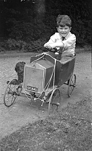 Boy in Toy Car.