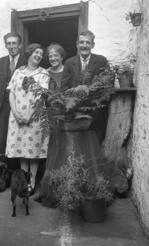 Grandma Naylor (laughing in dress) with friends.