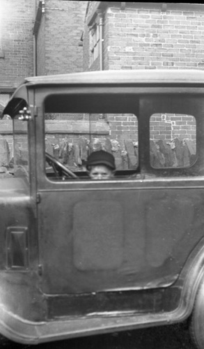 Boy in car.