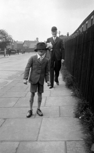 Great Uncle Leonard and Uncle Ronnie swapping hats, 1930s (approx.)